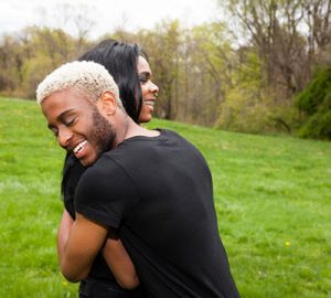 Two people hugging and smiling