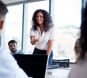 A woman speaking in a boardroom