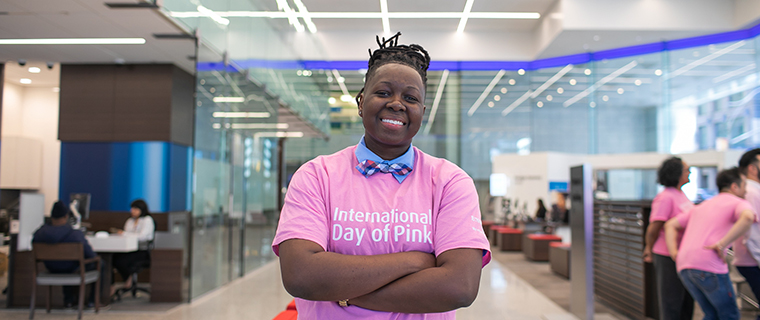 A woman wearing a pink International Day of Pink t-shirt